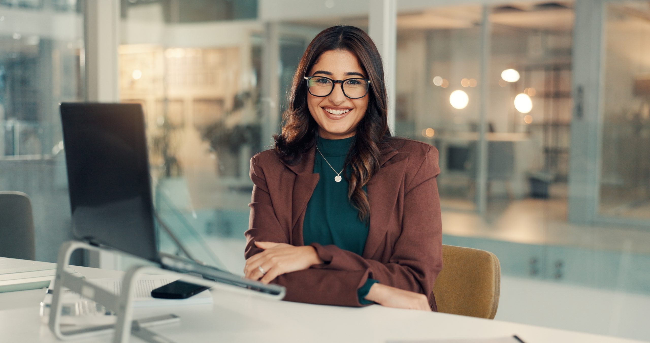 Accounting professional working with financial reports and a calculator